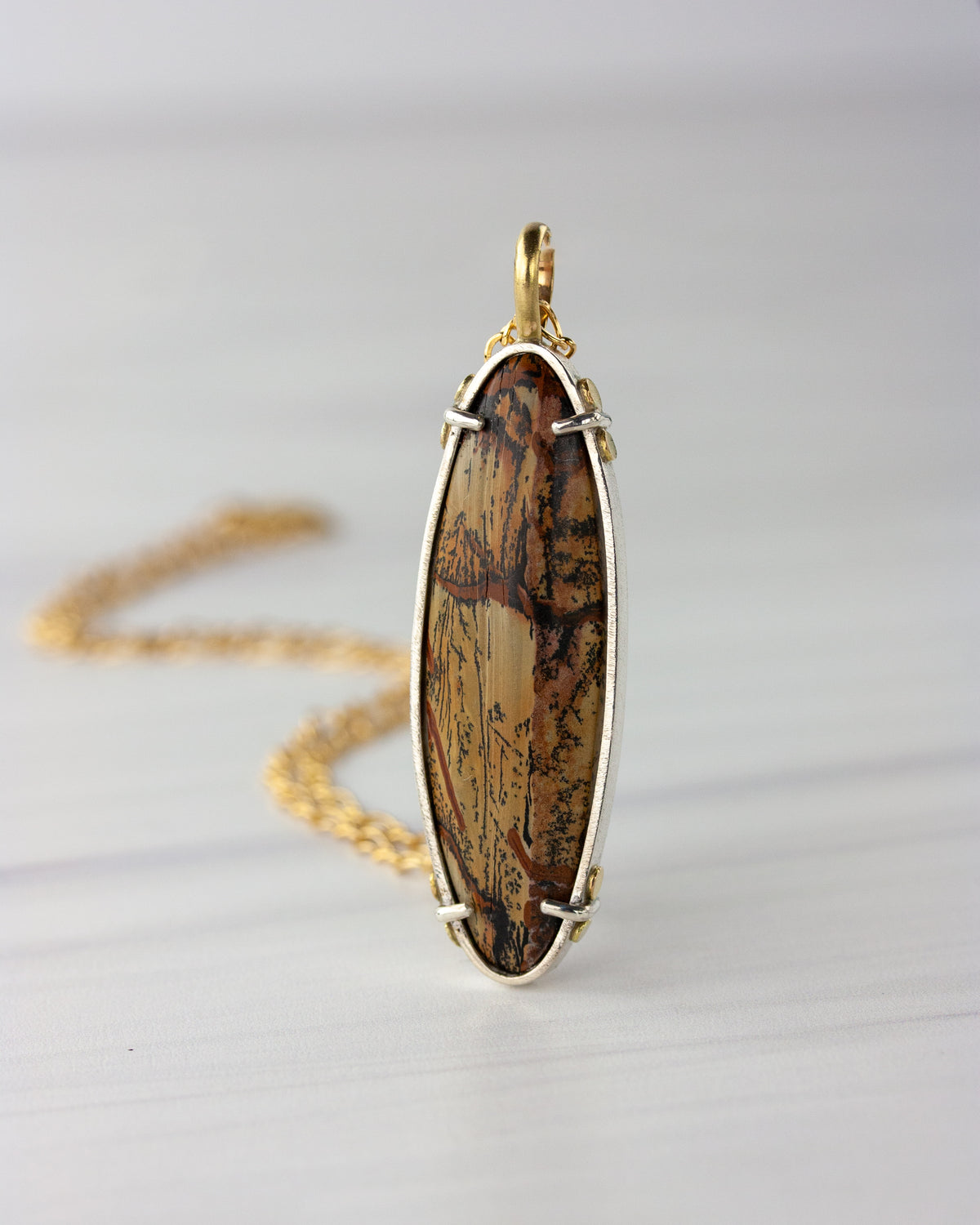 Indian paint stone pendant in silver and gold