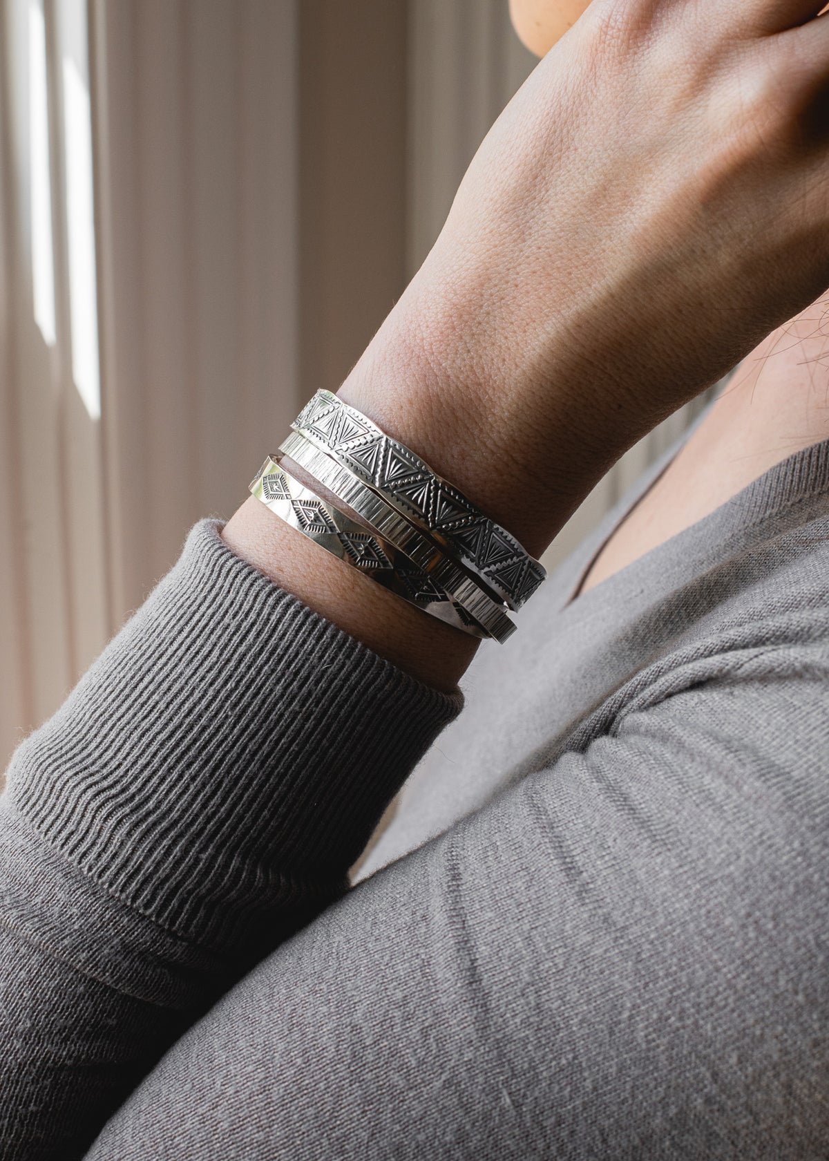 Stack of sterling silver bracelets