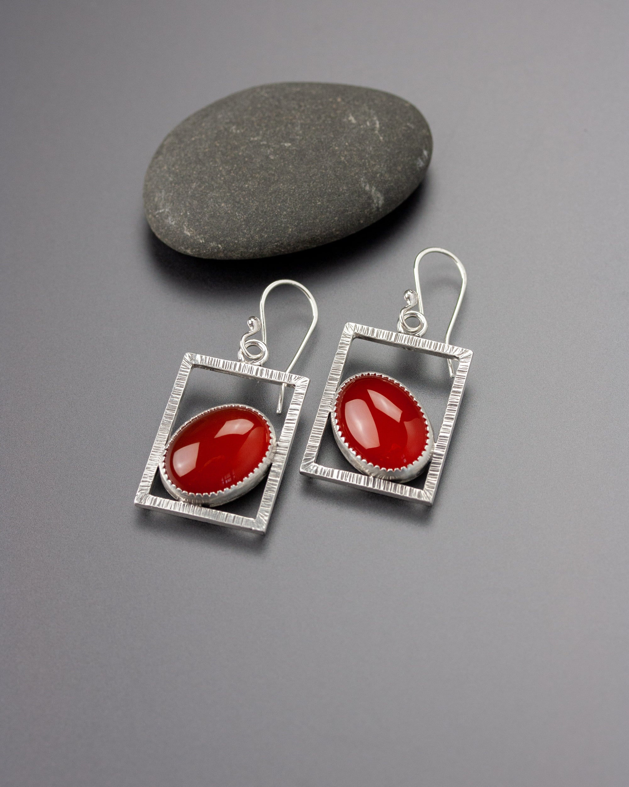 Carnelian earrings with textured silver frames